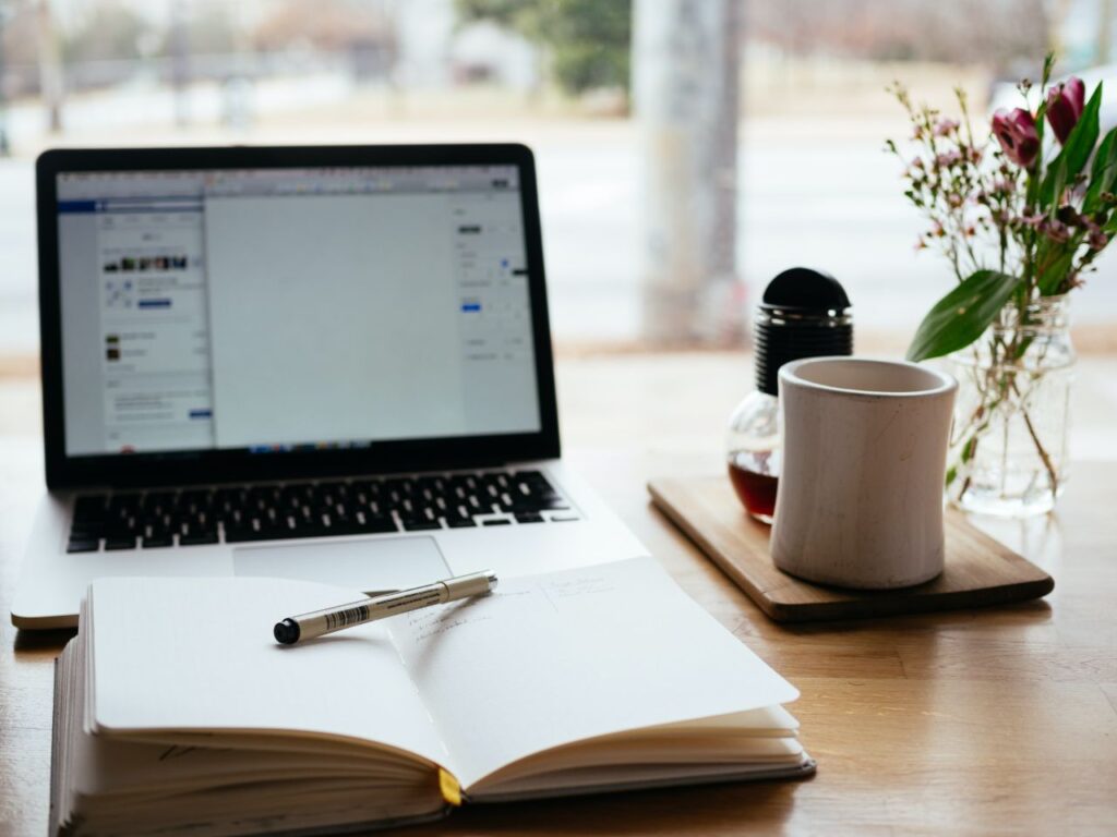 notebook laptop cup table